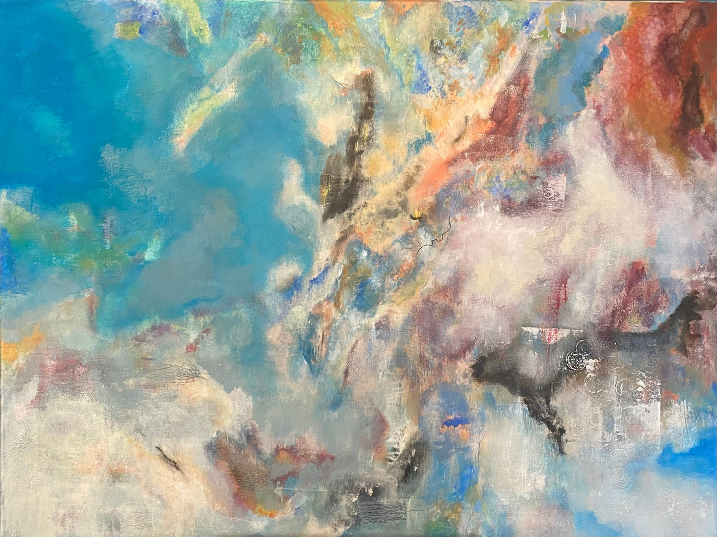 An abstract artwork featuring a blend of blue, orange, and other colors in a cloud-like formation against a light blue background.