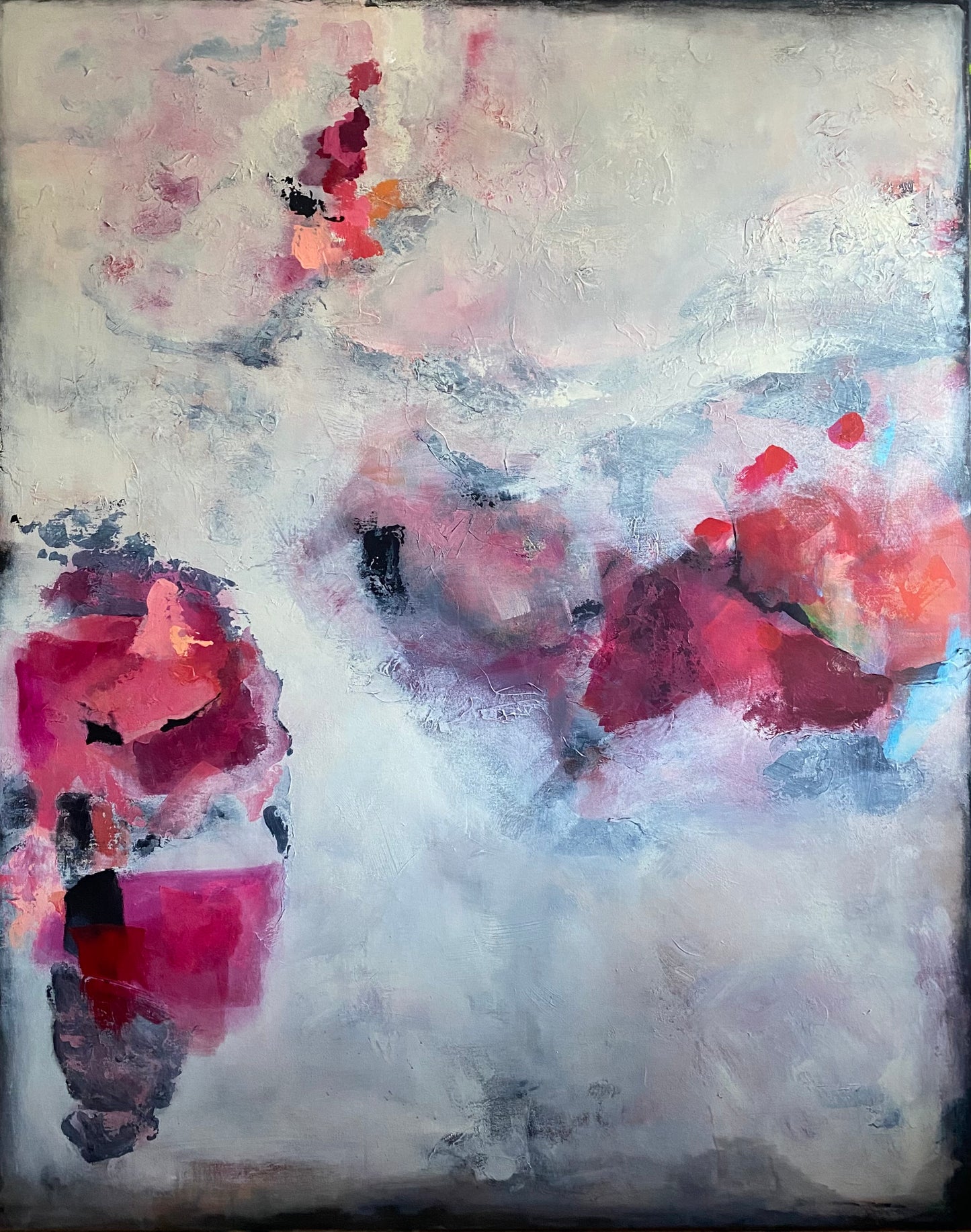Abstract art piece with pink and red floral elements on a textured background